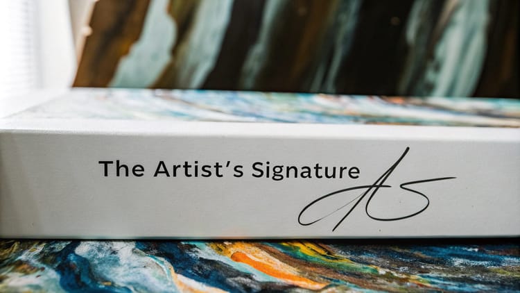 Close-up of canvas with 'The Artist's Signature' and a stylized mark, illustrating signature artifacts in AI art.